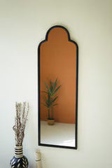 Antique black iron mirror with arched top